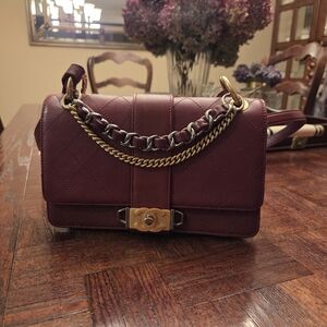 CHANEL Burgundy Crossbody Bag with Gold & Silver Chains And Leather Strap.